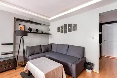 a living room with a couch and a table at HANDMADE in Istanbul