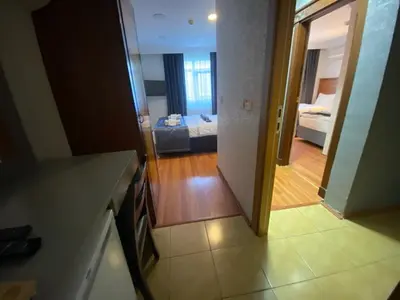 a view of a kitchen and a living room at Timex Suites in Istanbul