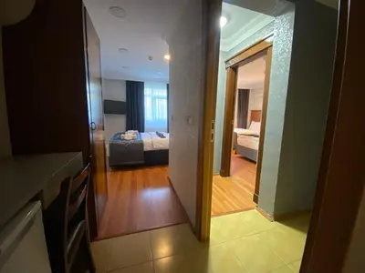 a view of a room with a bedroom and a living room at Timex Suites in Istanbul