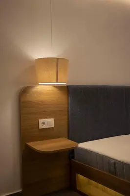 a small room with a bed and a light at Design Apartment near the Bomonti in Istanbul