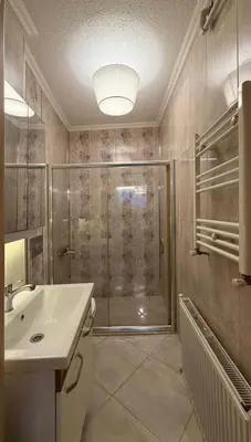 a bathroom with a shower and a sink at Design Apartment near the Bomonti in Istanbul