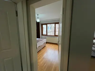 an empty room with a bed and a window at Gulhane Hotel Old City in Istanbul