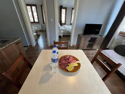 a table with a cake and a bottle of water at Gulhane Hotel Old City in Istanbul
