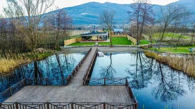 a house on a dock in the middle of a lake at Vital Göl Sapanca Özel Havuzlu Bungalov & Villa in Sapanca