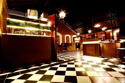 a room with a checkered floor in a restaurant at Montania Special Class Hotel in Mudanya