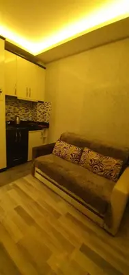 a living room with a couch in a kitchen at taksim k suites in Istanbul