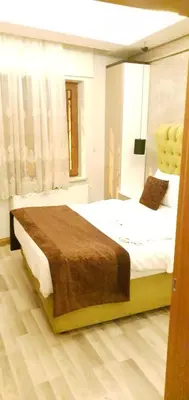 a bedroom with a large bed in a room at taksim k suites in Istanbul