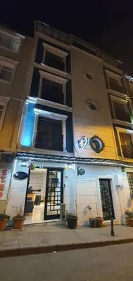 a building with a door and windows on a street at taksim k suites in Istanbul