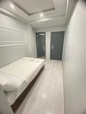 a white room with a bed in it at Abam Hotel in Istanbul