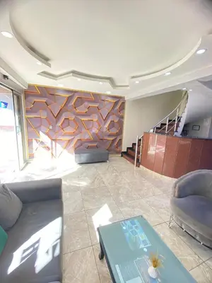 a living room with a couch and a table at Abam Hotel in Istanbul