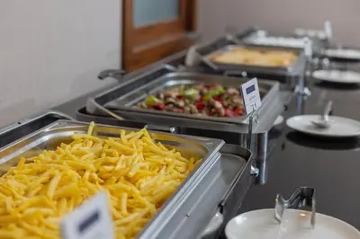 a buffet of food with french fries and other foods at Anemon Bursa Otel in Bursa
