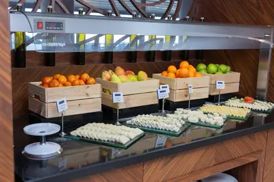 a display of fruits and vegetables in wooden boxes at Anemon Bursa Otel in Bursa