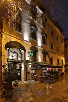 a green traffic light in front of a building at Impera Hotel - Special Category in Istanbul
