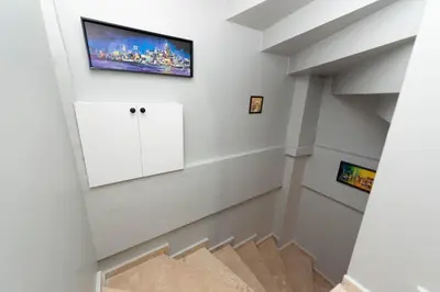 a living room with a tv on the wall at Leyla palas in Istanbul