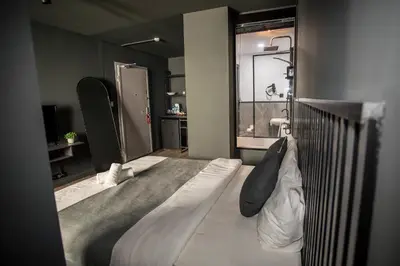 a hotel room with a bed and a bathroom at Arkem Deluxe in Istanbul