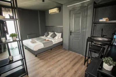 a small bedroom with a bed and a ladder at Arkem Deluxe in Istanbul