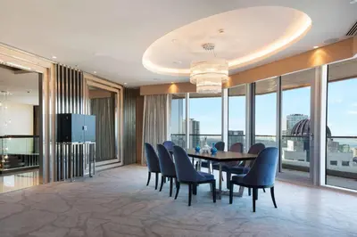 a dining room with a table and chairs at Wyndham Grand Istanbul Levent Hotel & Conference Center in Istanbul