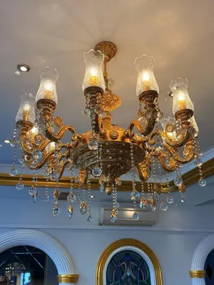 a gold chandelier hanging from a ceiling at Green Anka Hotel in Istanbul
