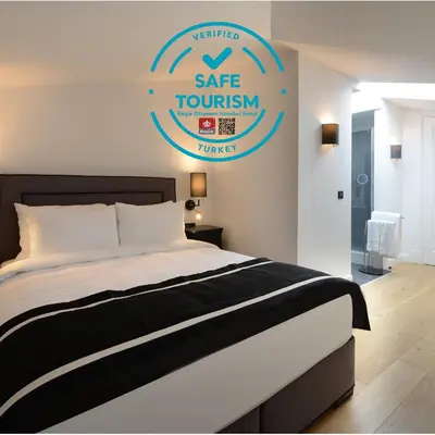 a bedroom with a bed and a sign that reads safe tourism at Régie Ottoman Istanbul - Special Category in Istanbul