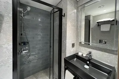 a bathroom with a sink and a shower at Woxx Hotel in Istanbul
