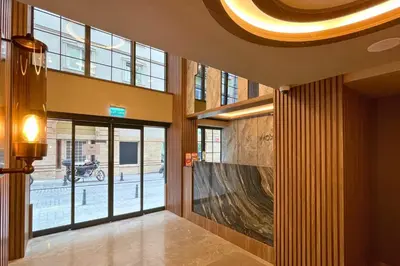 a lobby with a large glass door in a building at Woxx Hotel in Istanbul