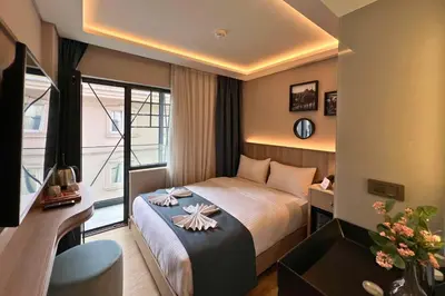 a hotel room with a bed and a window at Woxx Hotel in Istanbul
