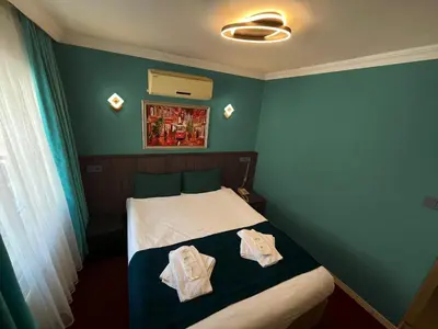 a bedroom with a bed with two towels on it at Le Safran in Istanbul