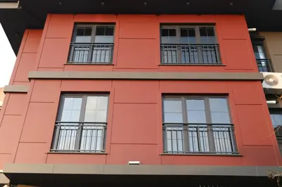 a red building with windows at ARC HOUSE in Istanbul