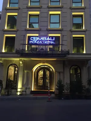 a hotel with a sign on the side of a building at Cumbali Plaza Hotel in Istanbul