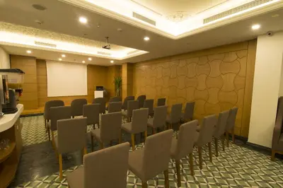 a conference room with chairs and a whiteboard at Cumbali Plaza Hotel in Istanbul