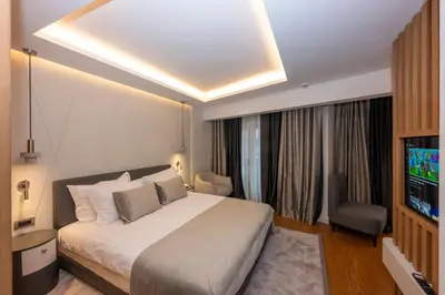 a hotel room with a bed and a television at Baver Hotel in Istanbul