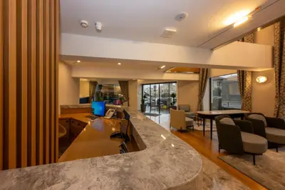 a kitchen and living room with a large counter top at Baver Hotel in Istanbul