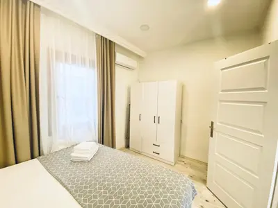 a bedroom with a bed and a white cabinet at Historical comfy flat in Beyoğlu tophane, galata in Istanbul