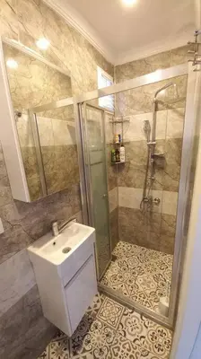 a bathroom with a shower and a sink at Historical comfy flat in Beyoğlu tophane, galata in Istanbul