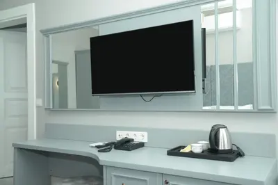 a flat screen tv hanging on a wall at CK SULTANAHMET HOTEL in Istanbul