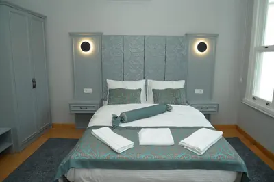 a bedroom with a large bed with two pillows at CK SULTANAHMET HOTEL in Istanbul