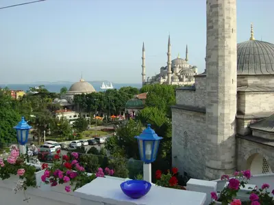 a view of a city from a balcony with a blue vase at No20 Hotel Sultanahmet in Istanbul