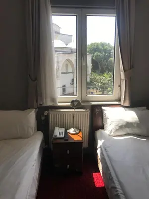 a hotel room with two beds and a window at No20 Hotel Sultanahmet in Istanbul