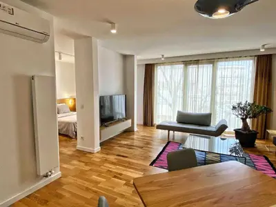 a living room with a television and a table at BFlatz in Istanbul