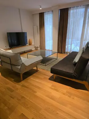 a living room with a couch and a glass table at BFlatz in Istanbul