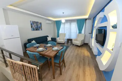 a living room with a table and a couch at Uzay Suite 1 in Istanbul