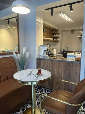 a restaurant with a table and a counter at Iris Han Hotel in Istanbul