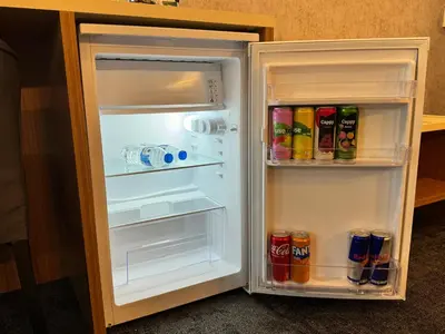 an open refrigerator filled with drinks and soda at E5 PARK OTEL in Esenyurt