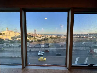 a view of a parking lot from a window at E5 PARK OTEL in Esenyurt