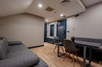a living room with a couch and a table at The Row Suites Taksim in Istanbul