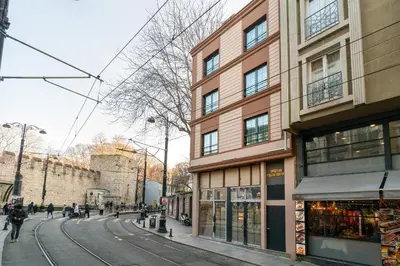 a building on a street with people walking on the street at Urban Quarters - Gülhane in Istanbul