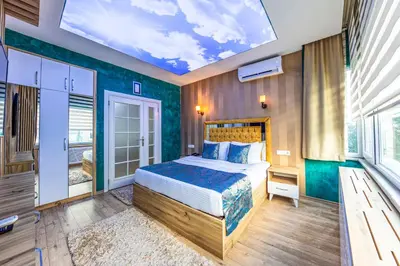 a bedroom with a bed and a skylight at Sisli Form Hotel in Istanbul