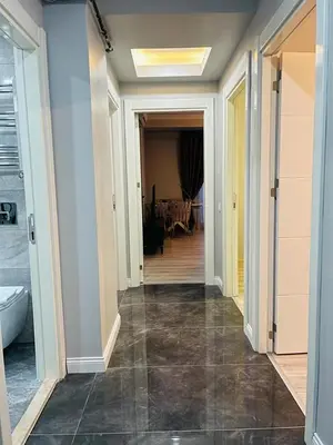 a hallway leading to a dining room with a table at Cantrmen Suites in Istanbul