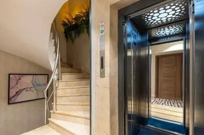 a hallway with stairs and a door to a building at The Capri Hotel Osmanbey in Istanbul