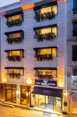 an apartment building with flowerpots on the balconies at The Capri Hotel Osmanbey in Istanbul